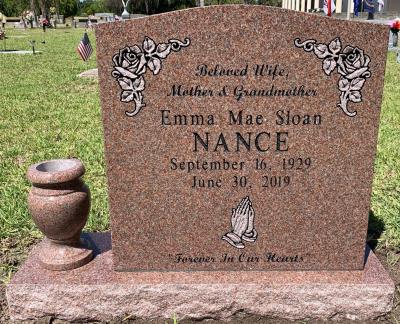single upright all polished morning rose granite headstone with flower vase and rose design